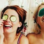 two girls with eye masks lying down